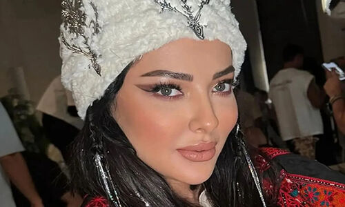 لیلا اوتادی کنار جواد افشار در پشت‌صحنه «گاندو»